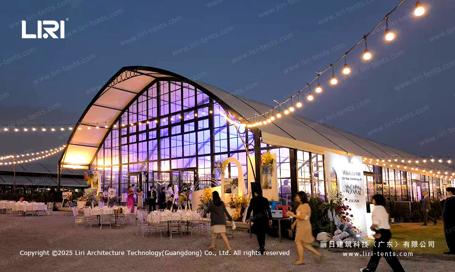 Evening modular wedding tent setup for a hospitality venue