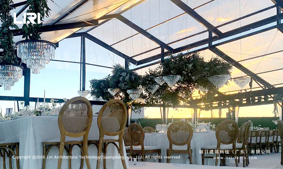Aluminum orangery wedding reception at sunset