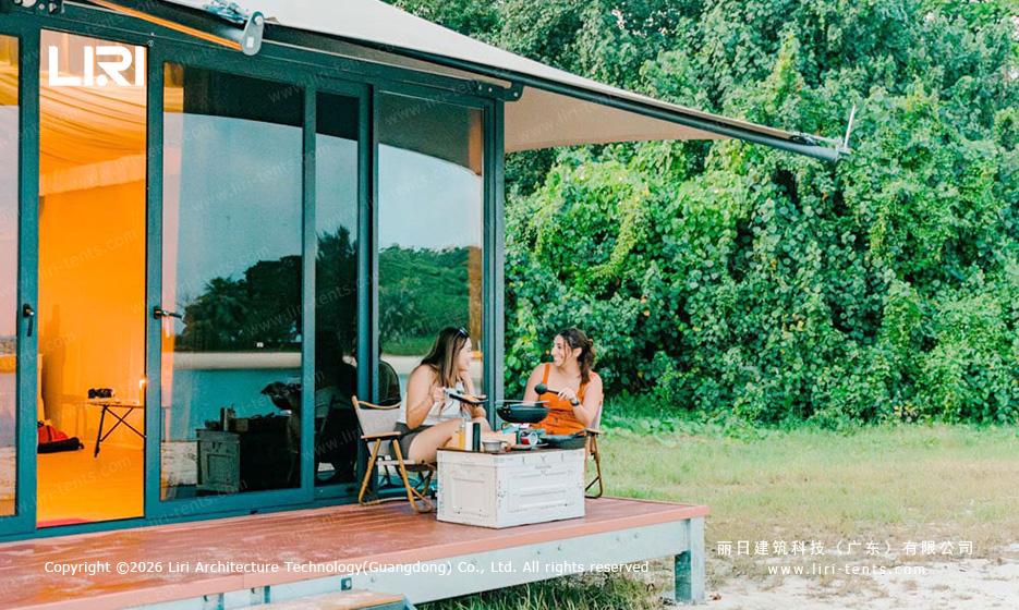 Indian-style glamping tent resort beach view Singapore — multi-peak event tents and single-peak tipi suites on raised wooden deck, aluminum frame PVC canopy