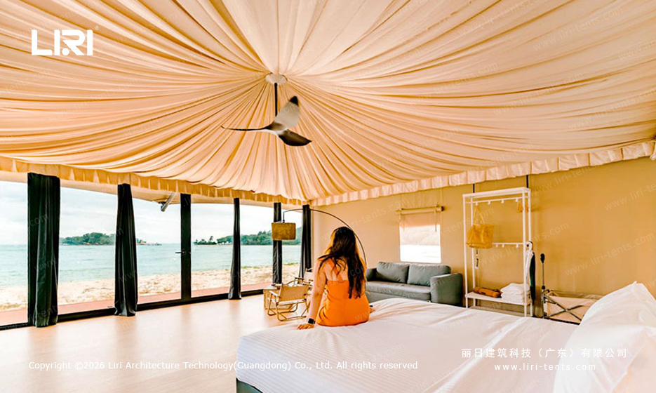 Guest opening curtains ocean view Indian tent — luxury glamping experience, beachfront resort suite, canvas tent