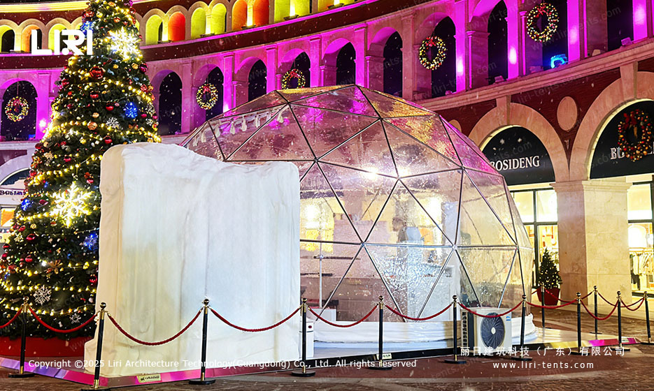 Illuminated dome tent venue with evening event lighting