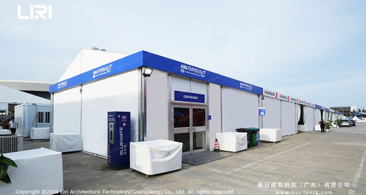 ABS hard wall service pavilion with Formula E branding and blue accents