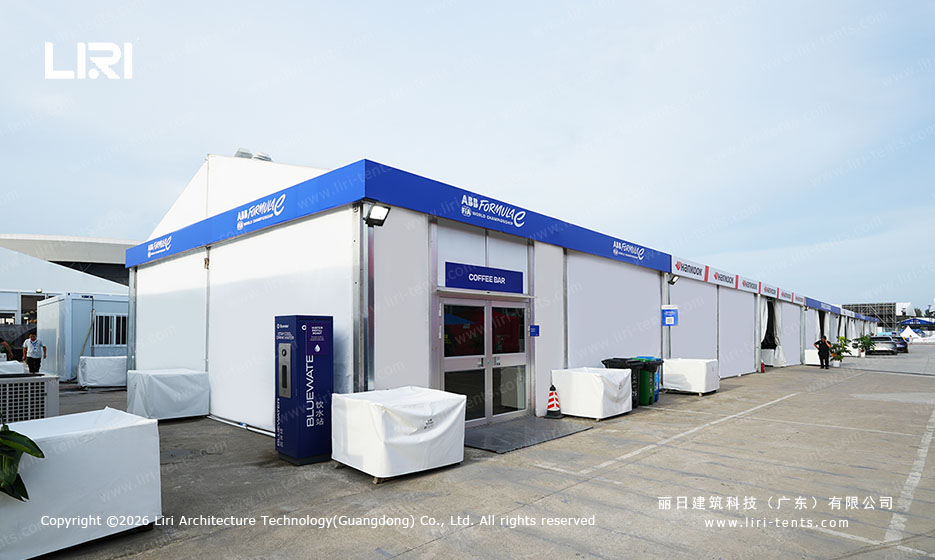 ABS hard wall service pavilion with Formula E branding and blue accents