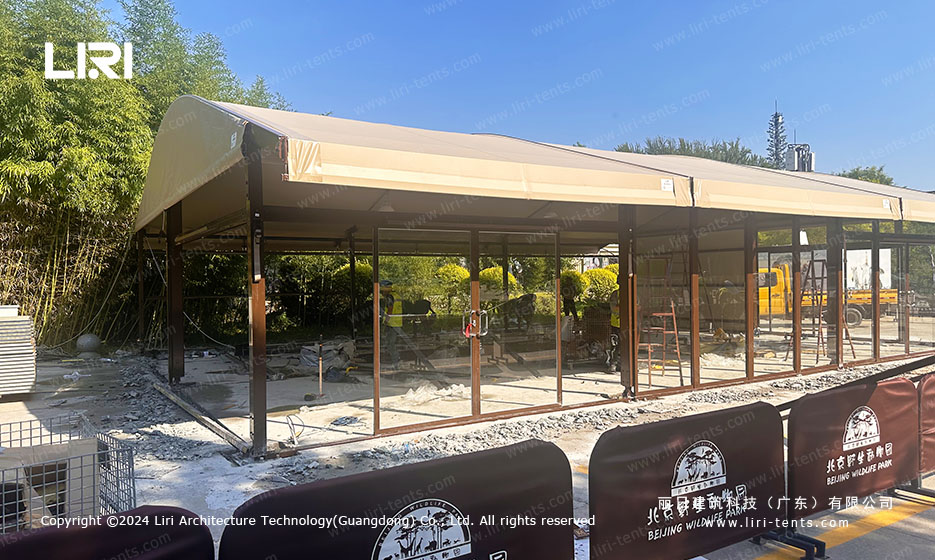 Arc top tent with glass walls under construction