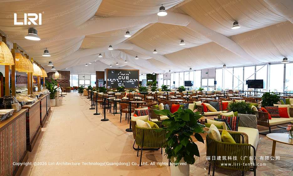 Cocktail area inside ABS marquee with Formula E backdrop