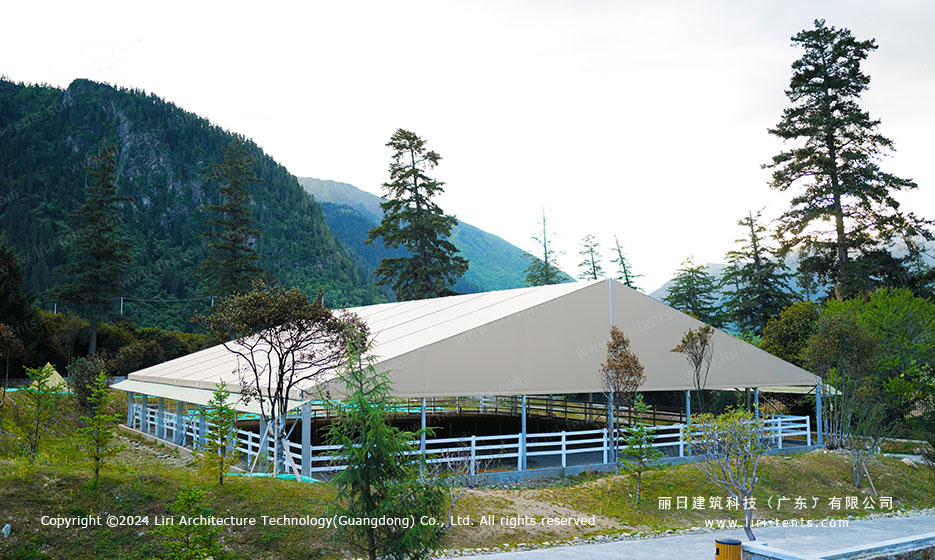 Equestrian riding arena tent in a mountain valley
