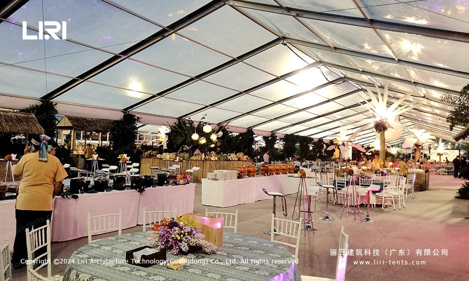 Buffet stations inside transparent roof clear-span tent with food service setup
