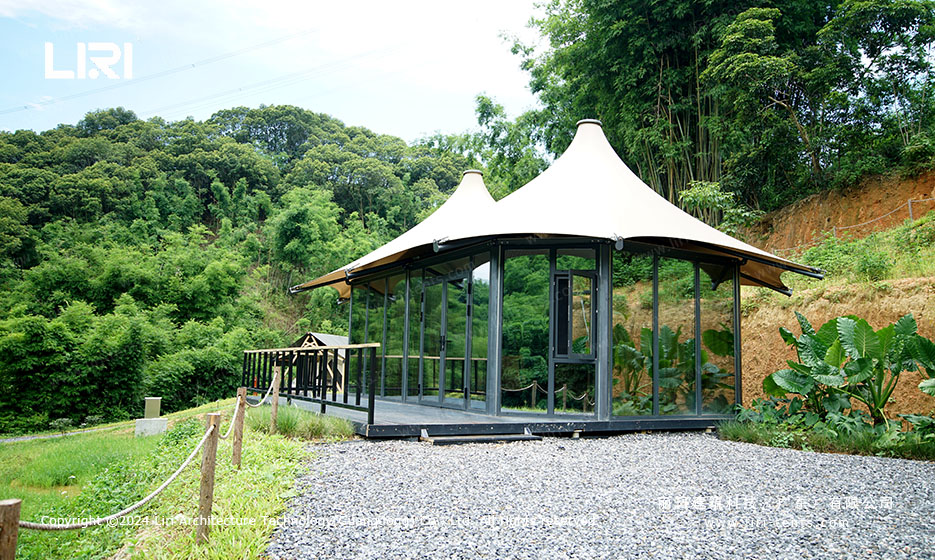 Twin-peak tipi tent glass wall and wooden deck setup for glamping