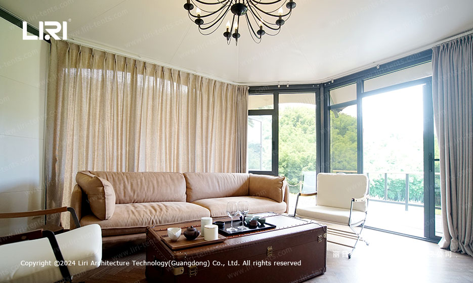 Living room interior of luxury glamping tent with sofa and tea set
